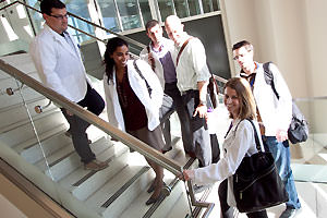 Medical students walking down stairwell